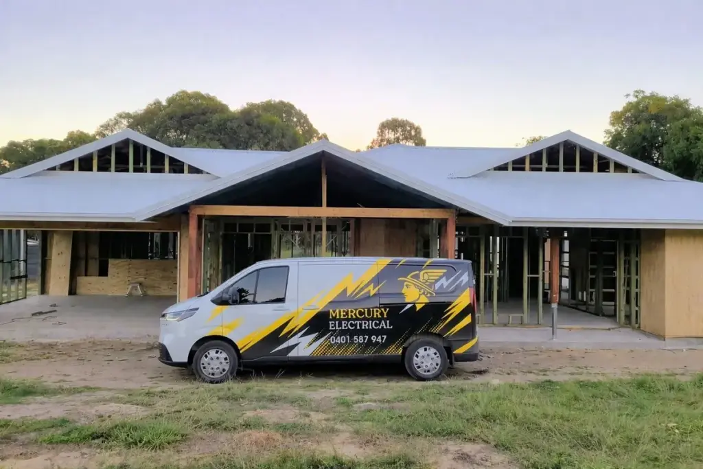 Mercury Electrical QLD van parked at a new home build at dusk