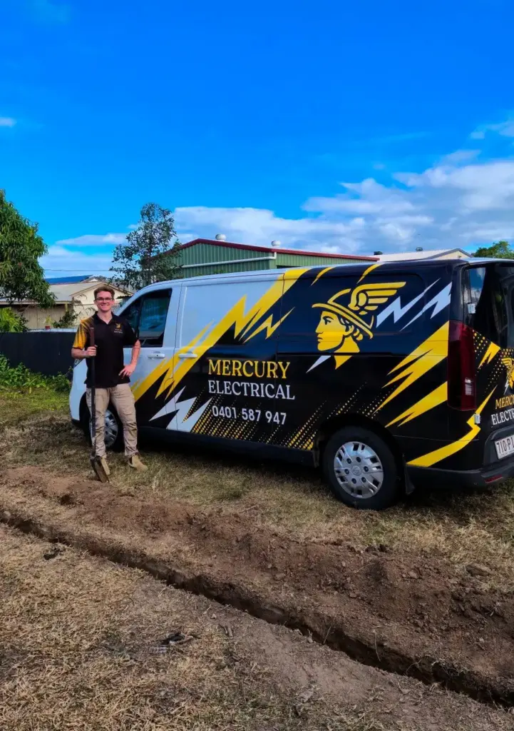 Mitchell from Mercury Electrical QLD standing beside his van next to a freshly dug cable trench